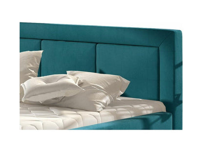 Letto in velluto blu trapuntato